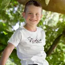 dorfkind-t-shirt-mockup-featuring-a-boy-sitting-on-a-tree-2926-el1webp.webp